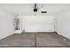 Garage with overhead door and ample space at 38155 W Excussare Way, Maricopa, AZ 85138