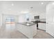 Open concept kitchen with island and stainless steel appliances at 38155 W Excussare Way, Maricopa, AZ 85138