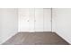 Spacious bedroom with double door closet and neutral carpeting at 38155 W Excussare Way, Maricopa, AZ 85138