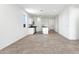Open kitchen with granite countertops and modern appliances at 38155 W Excussare Way, Maricopa, AZ 85138