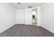 Bright bedroom with gray carpet and ensuite bathroom access at 38155 W Excussare Way, Maricopa, AZ 85138