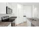 Open concept kitchen with island and stainless steel appliances at 38155 W Excussare Way, Maricopa, AZ 85138