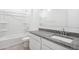 Bathroom boasts granite countertop, white cabinets and bathtub at 38155 W Excussare Way, Maricopa, AZ 85138