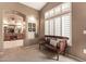 Spa-like bathroom with a bench and view into the bedroom at 6907 E Teton Cir, Mesa, AZ 85207