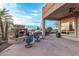 Outdoor patio with fireplace, seating, and built-in grill at 6907 E Teton Cir, Mesa, AZ 85207