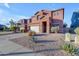 Two-story house with a white garage door and desert landscaping at 964 W Saguaro Ln, San Tan Valley, AZ 85143