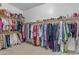 Large walk-in closet with ample shelving and hanging space at 964 W Saguaro Ln, San Tan Valley, AZ 85143