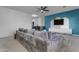 Gathering room with gray sectional sofa and accent wall at 964 W Saguaro Ln, San Tan Valley, AZ 85143