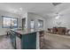 Modern kitchen featuring teal cabinets and granite countertops at 964 W Saguaro Ln, San Tan Valley, AZ 85143