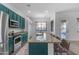 Stylish teal kitchen with stainless steel appliances at 964 W Saguaro Ln, San Tan Valley, AZ 85143