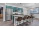 Modern kitchen featuring stainless steel appliances and teal cabinetry at 964 W Saguaro Ln, San Tan Valley, AZ 85143