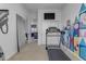 Home gym with a treadmill and an adjacent mirrored wall at 964 W Saguaro Ln, San Tan Valley, AZ 85143