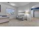 Cozy sitting room with a sofa and access to a bathroom at 964 W Saguaro Ln, San Tan Valley, AZ 85143
