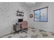 Bright home office features built-in shelving and a Mickey Mouse rug at 964 W Saguaro Ln, San Tan Valley, AZ 85143