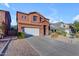 Two-story house with a white garage door and landscaping at 964 W Saguaro Ln, San Tan Valley, AZ 85143