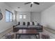 Spacious sitting room with gray sectional sofa and coffee table at 964 W Saguaro Ln, San Tan Valley, AZ 85143