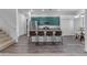 Kitchen with teal cabinets, granite countertops, and island seating at 964 W Saguaro Ln, San Tan Valley, AZ 85143