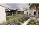 Luxury home with expansive backyard, featuring a grassy area and lush landscaping at 5704 N Wilkinson Rd, Paradise Valley, AZ 85253