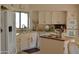 Bright kitchen featuring white cabinets, island, and modern appliances at 7232 E Maverick Rd, Scottsdale, AZ 85258