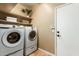 Laundry room with Samsung washer and dryer, shelving, and storage at 15612 N 174Th Ave, Surprise, AZ 85388