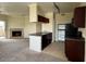 Kitchen with dark cabinets and a breakfast bar at 16013 S Desert Foothills Pkwy # 2112, Phoenix, AZ 85048