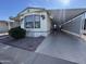 Mobile home with carport and landscaped yard at 4065 E University Dr # 503, Mesa, AZ 85205