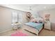 bedroom with white bed frame and pink decor at 19834 W Rancho Dr, Litchfield Park, AZ 85340
