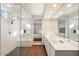 Spa-like bathroom with walk-in shower, double vanity, and modern finishes at 19834 W Rancho Dr, Litchfield Park, AZ 85340