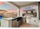 Modern outdoor kitchen with stainless steel appliances and a built-in grill at 19834 W Rancho Dr, Litchfield Park, AZ 85340