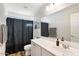 Bathroom with white vanity, toilet, and shower at 19834 W Rancho Dr, Litchfield Park, AZ 85340