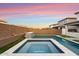 Luxury pool and spa with a tiled water feature and spacious backyard at 19834 W Rancho Dr, Litchfield Park, AZ 85340