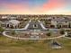 Aerial view of a residential neighborhood with a park and playground at 19834 W Rancho Dr, Litchfield Park, AZ 85340