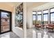 Bright entryway with modern room divider and seating area at 6432 E El Sendero Rd, Carefree, AZ 85377