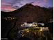 Luxury home on mountainside with pool and expansive views at sunset at 6432 E El Sendero Rd, Carefree, AZ 85377