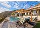 Luxury pool with mountain views and lounge chairs at 6432 E El Sendero Rd, Carefree, AZ 85377