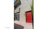 Front view of a townhouse with a red door and light-colored walls at 4610 N 68Th St # 414, Scottsdale, AZ 85251