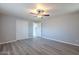 Well-lit bedroom featuring vinyl flooring and double doors to closet at 3014 W Mariposa St, Phoenix, AZ 85017