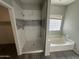 Bathroom with shower and separate tub, featuring modern tile at 1458 E Black Diamond Dr, Gilbert, AZ 85296