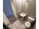 Clean bathroom with pedestal sink, toilet, and mirror at 1458 E Black Diamond Dr, Gilbert, AZ 85296