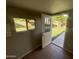 View of backyard from interior door; grassy area and trees at 1458 E Black Diamond Dr, Gilbert, AZ 85296