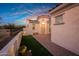 Home exterior with a courtyard and landscaping at 20594 W Pasadena Ave, Buckeye, AZ 85396