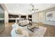 Bright living room with open floor plan and kitchen at 20594 W Pasadena Ave, Buckeye, AZ 85396