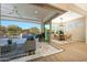 Bright dining area with sliding doors leading to a covered patio and pool at 20594 W Pasadena Ave, Buckeye, AZ 85396