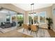 Casual dining area with glass table and chairs, view of the pool at 20594 W Pasadena Ave, Buckeye, AZ 85396