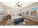 Spacious bedroom with ceiling fan, neutral decor, and ample natural light at 20594 W Pasadena Ave, Buckeye, AZ 85396
