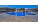 Freeform pool and spa with stone accents and lighting at 20594 W Pasadena Ave, Buckeye, AZ 85396