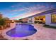 Relaxing pool and spa with outdoor seating and kitchen at 20594 W Pasadena Ave, Buckeye, AZ 85396