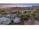 Aerial view of house with pool and mountain backdrop at 20594 W Pasadena Ave, Buckeye, AZ 85396