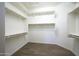 Spacious walk-in closet with ample shelving and hanging space at 20594 W Pasadena Ave, Buckeye, AZ 85396