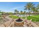 Relaxing fire pit area with surrounding seating at 20594 W Pasadena Ave, Buckeye, AZ 85396